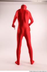 JOEL_ADAMSON CHRISTMAS VALLAIN WITH GUN AND BAG